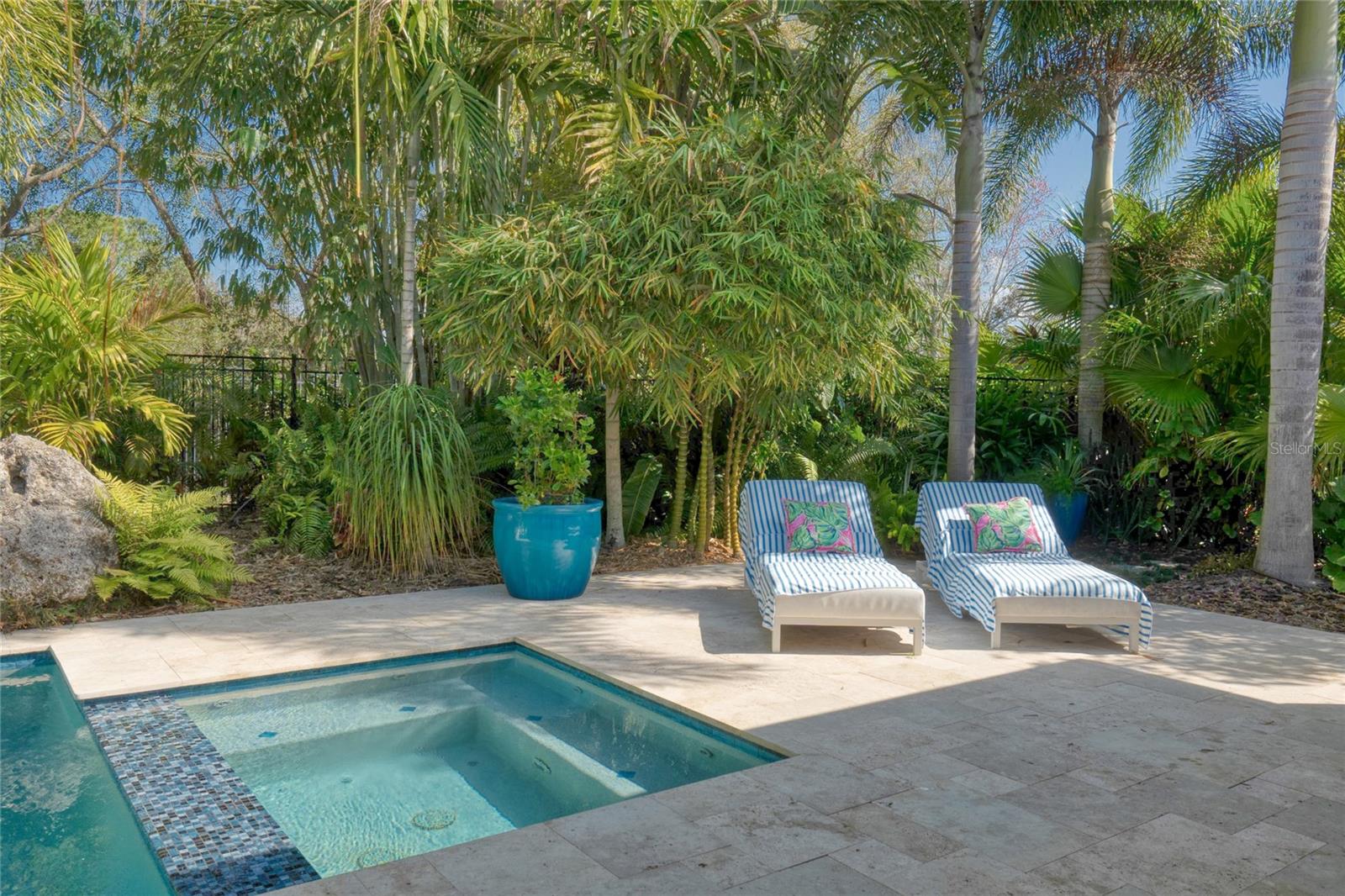 Lounge by the pool in this oasis