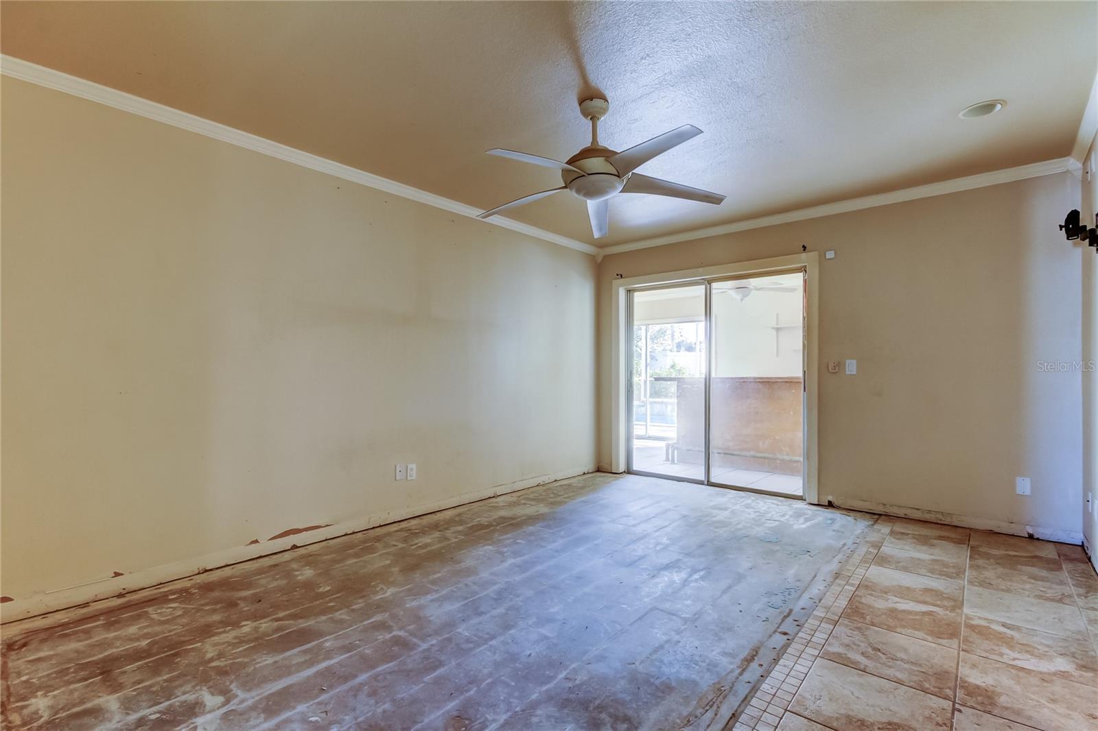 Primary Bedroom with Sliders to the Florida Room