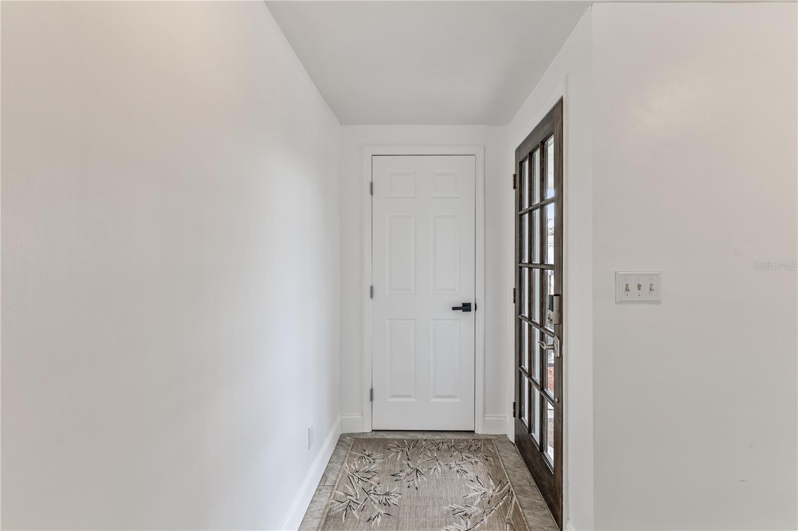 Front entry hall with closet