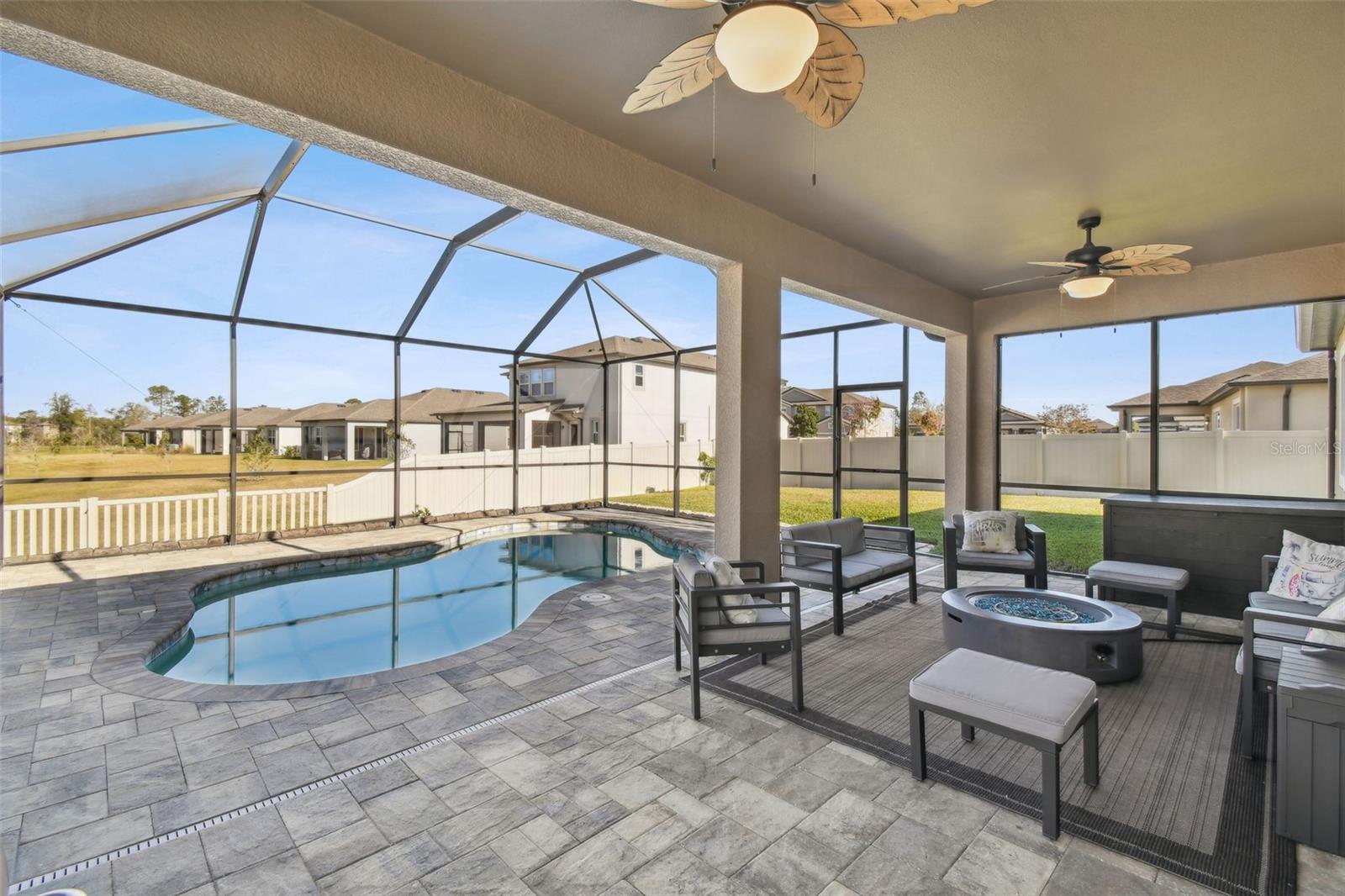 Covered and Screened Pool with patio doors on both sides.