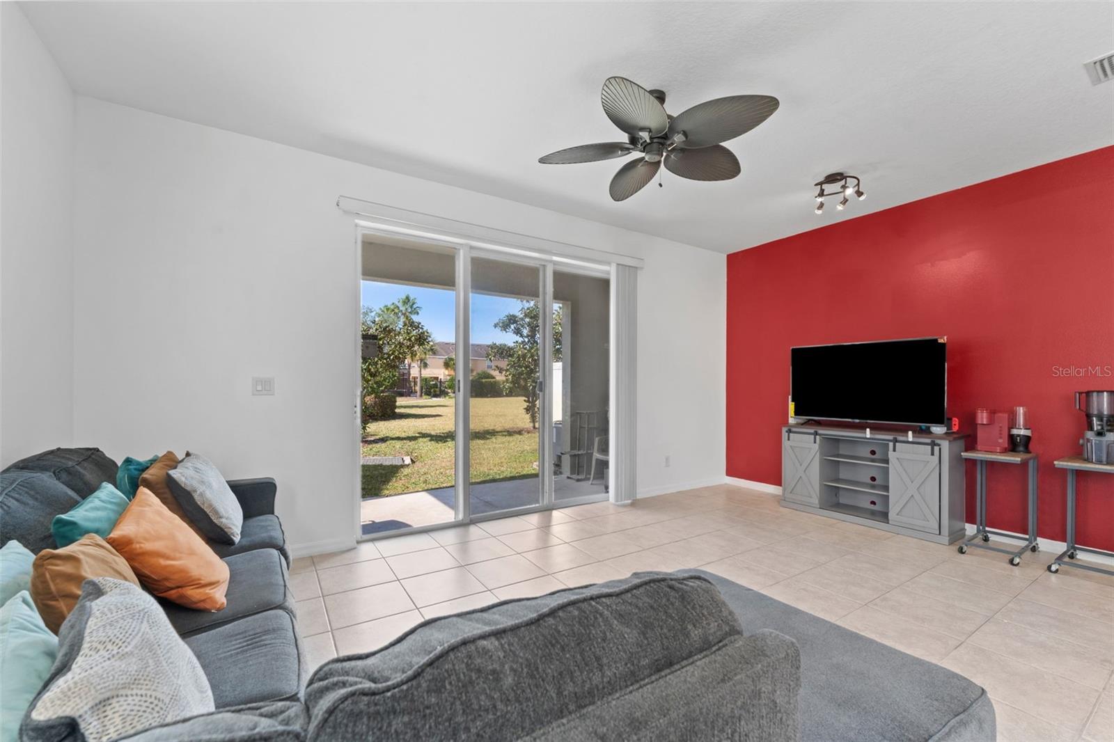 Living Room With Outdoor Lanai Views