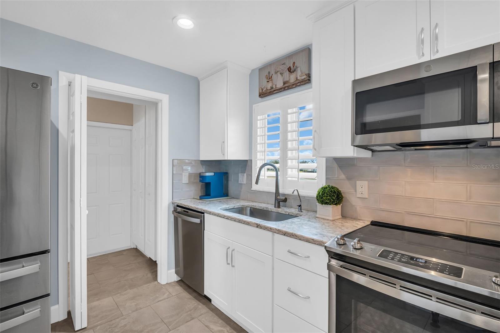 High elevation lot provides a blue sky view through sink window~