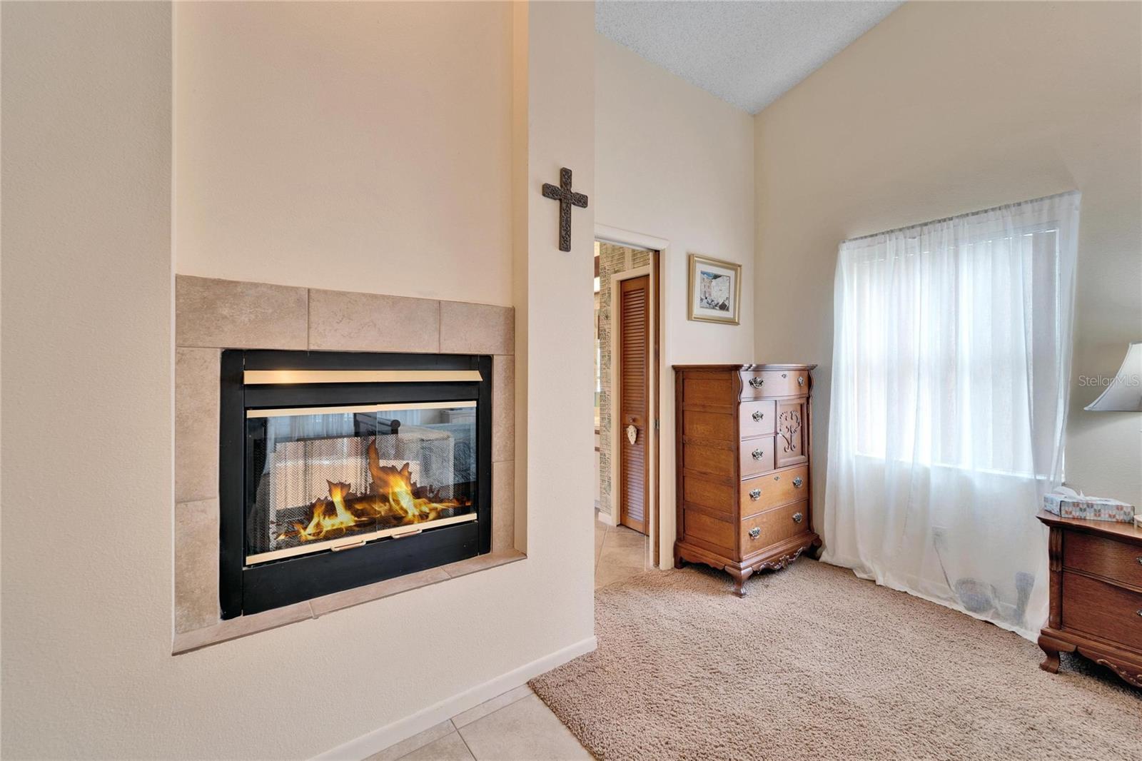 Double sided fireplace shared with primary bathroom/hot tub