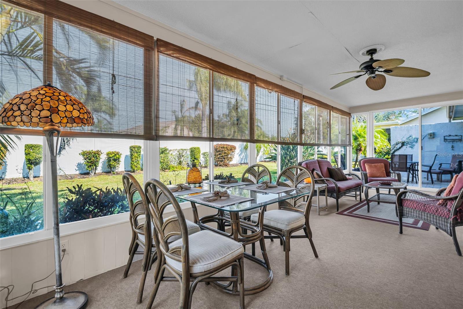 Sunroom & backyard have unusual privacy with perimeter wall and patio side wall~