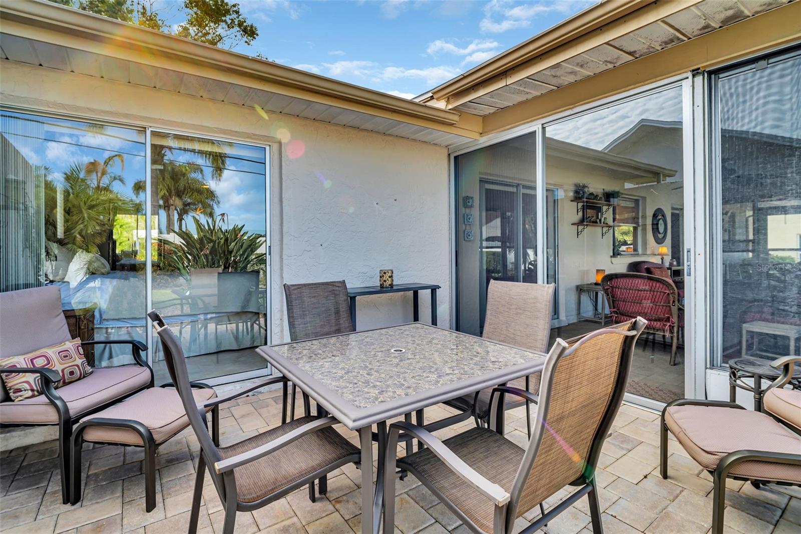 Private paver patio access from master bedroom & sunroom