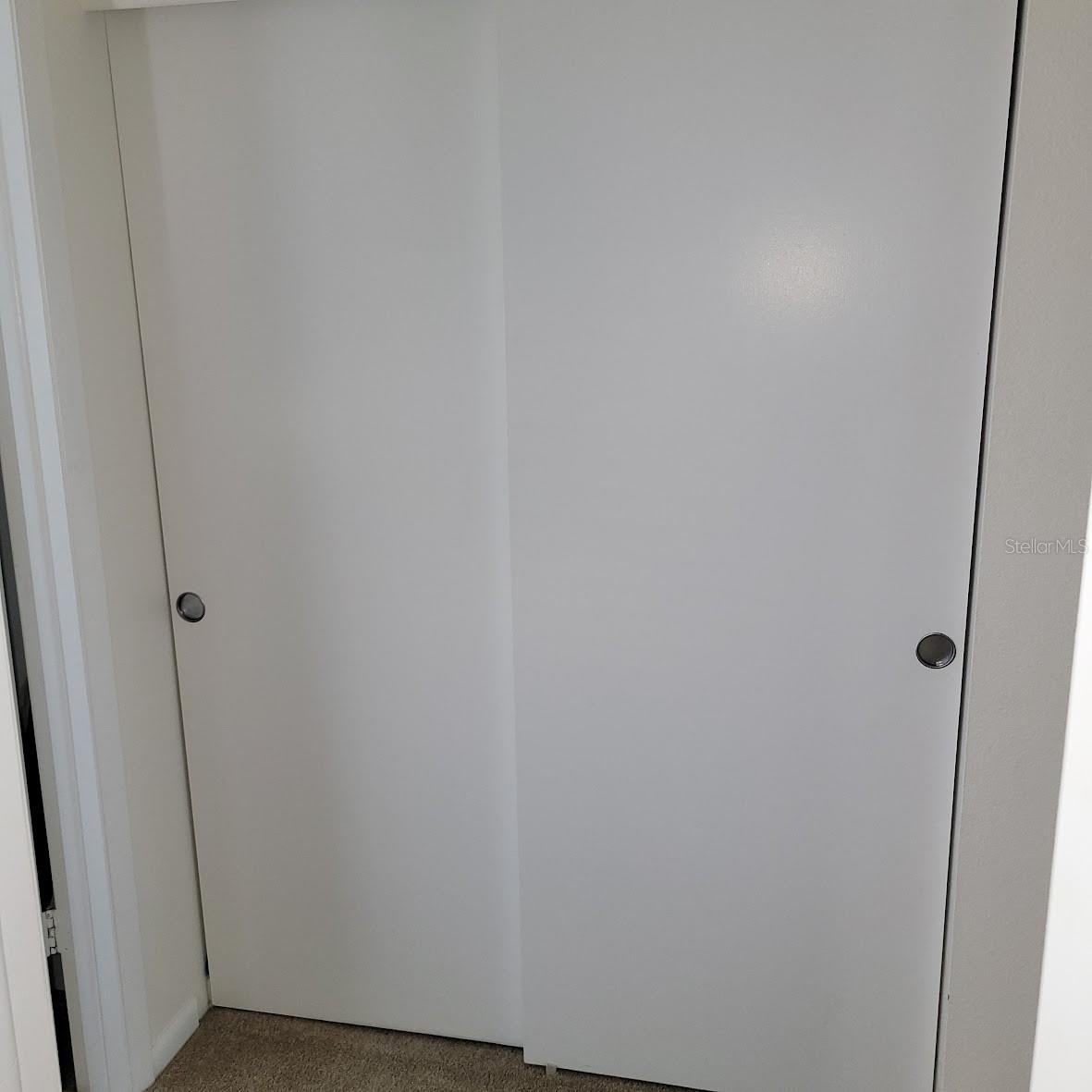 When leaving the primary Bedroom you will pass the Hall Closet with plenty of room to store a variety of things; coats, linens, cleaning supplies, etc.