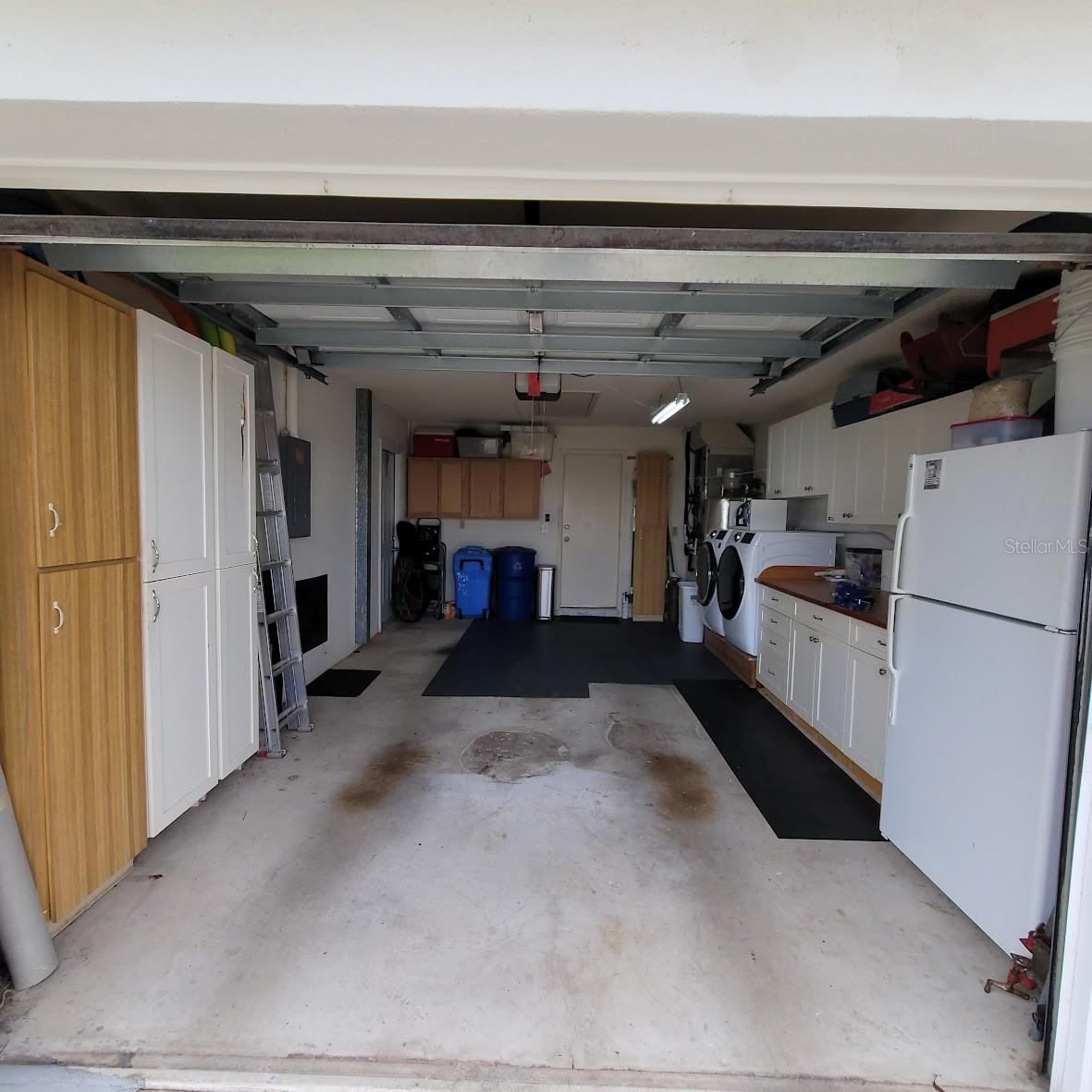 The 20X14 garage is loaded with storage cabinets to allow, A place for everything and everything in it's place.