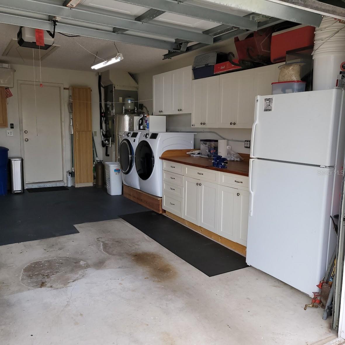 The washer, Dryer, and Garage fridge do not convey. Check out the cabinets though, as they stay!