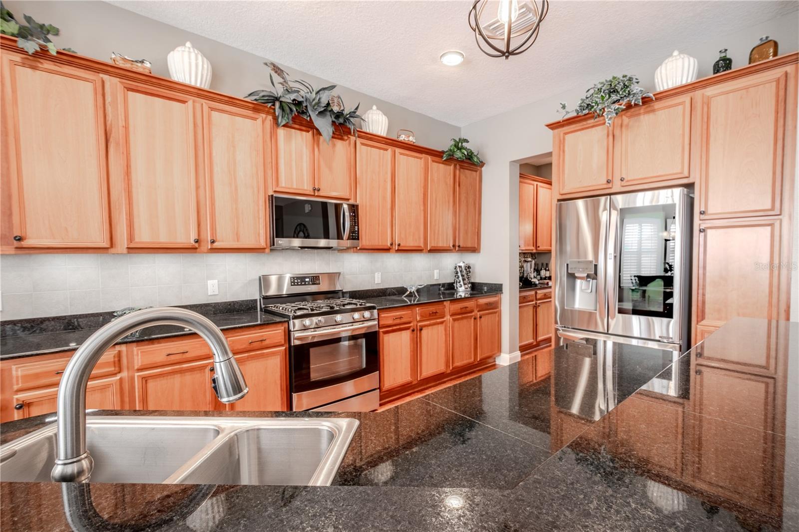 The Kitchen features a French Door refrigerator with icemaker and water dispenser