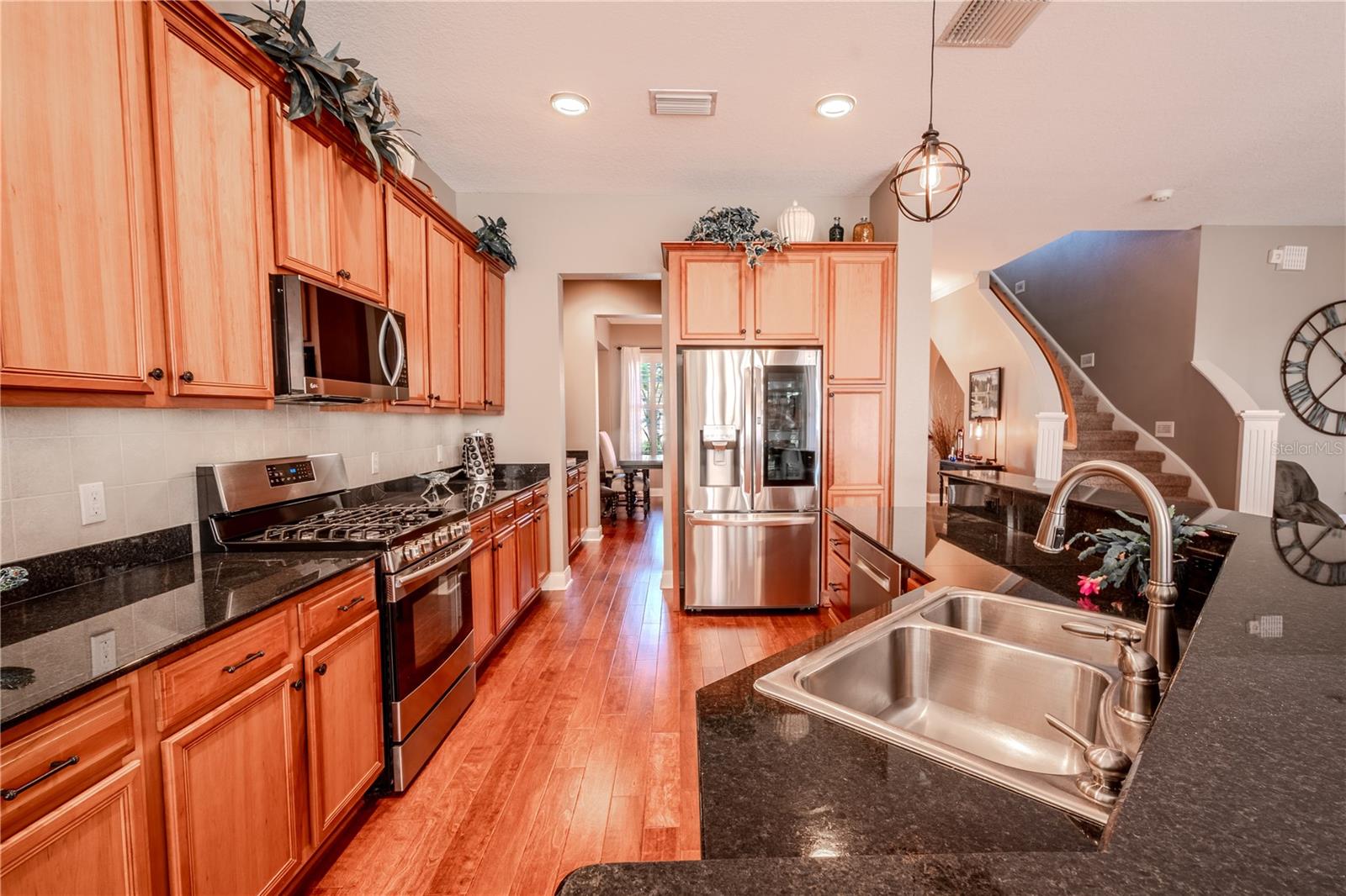 The kitchen is open to the family and dining rooms for effortless entertaining.