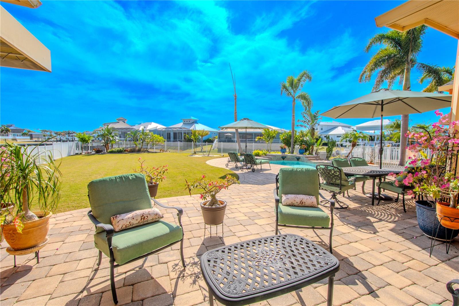 Pavered backyard patio and solar-heated pool.