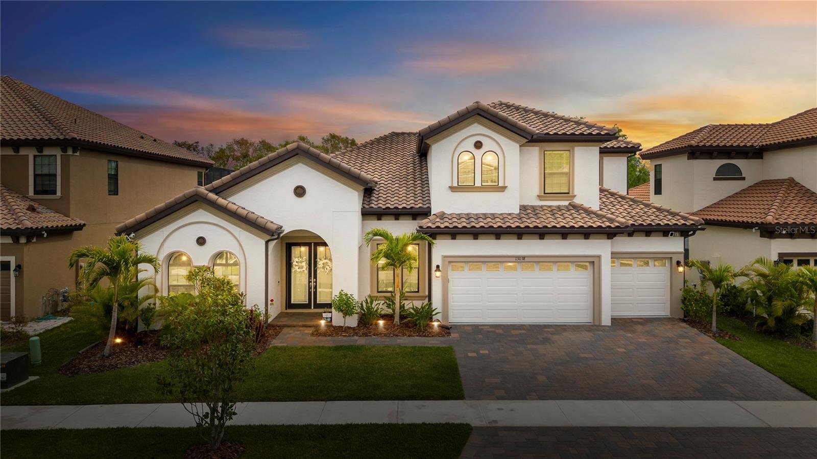 Welcome Home! Tile Roof, Paver Driveway and landscape uplighting!