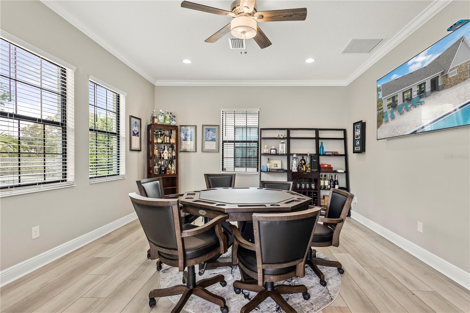 Bonus Room #1 - Main Floor, surrounded by windows, overlooking the backyard and pool area