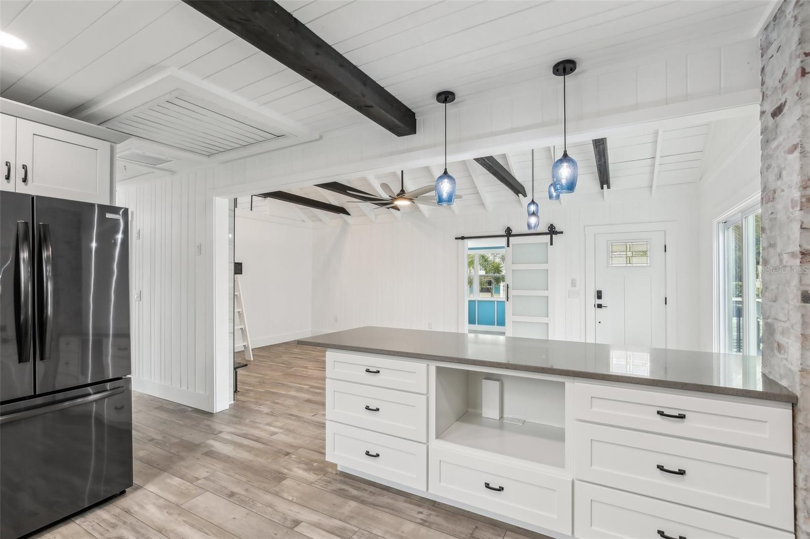 Add your favorite convection oven or air fryer to this under counter space with its own electrical outlet.