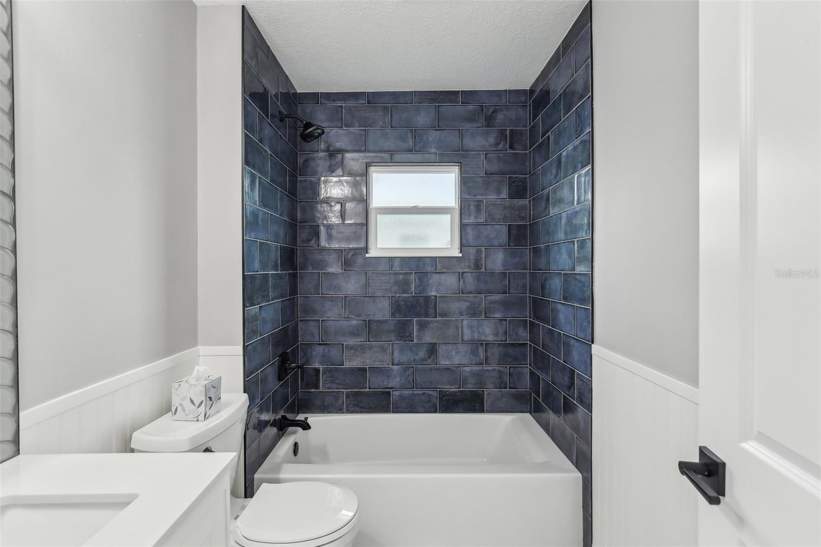 Bathroom #2 with tub and shower.