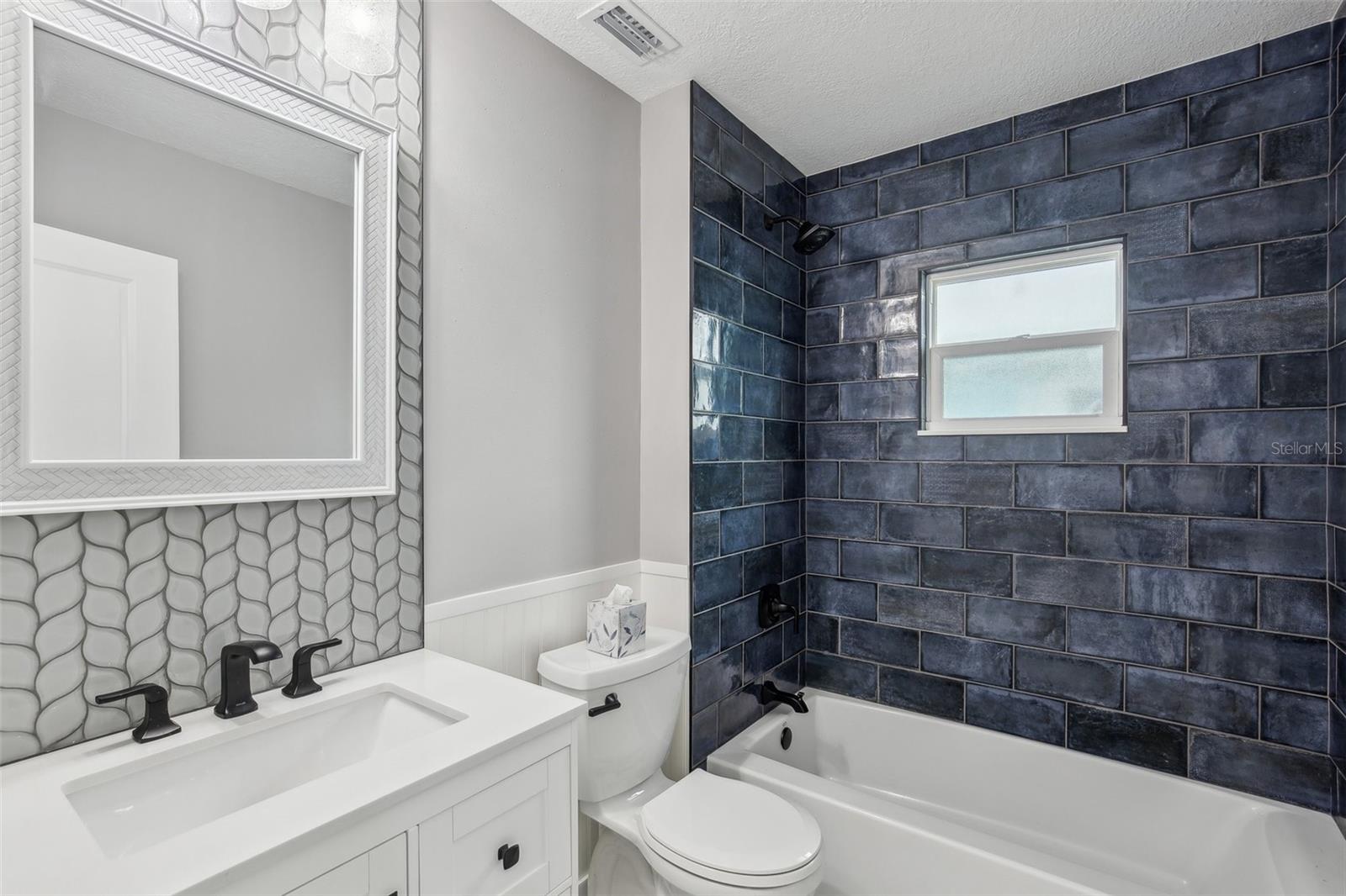 Bathroom #2 with tub and shower.