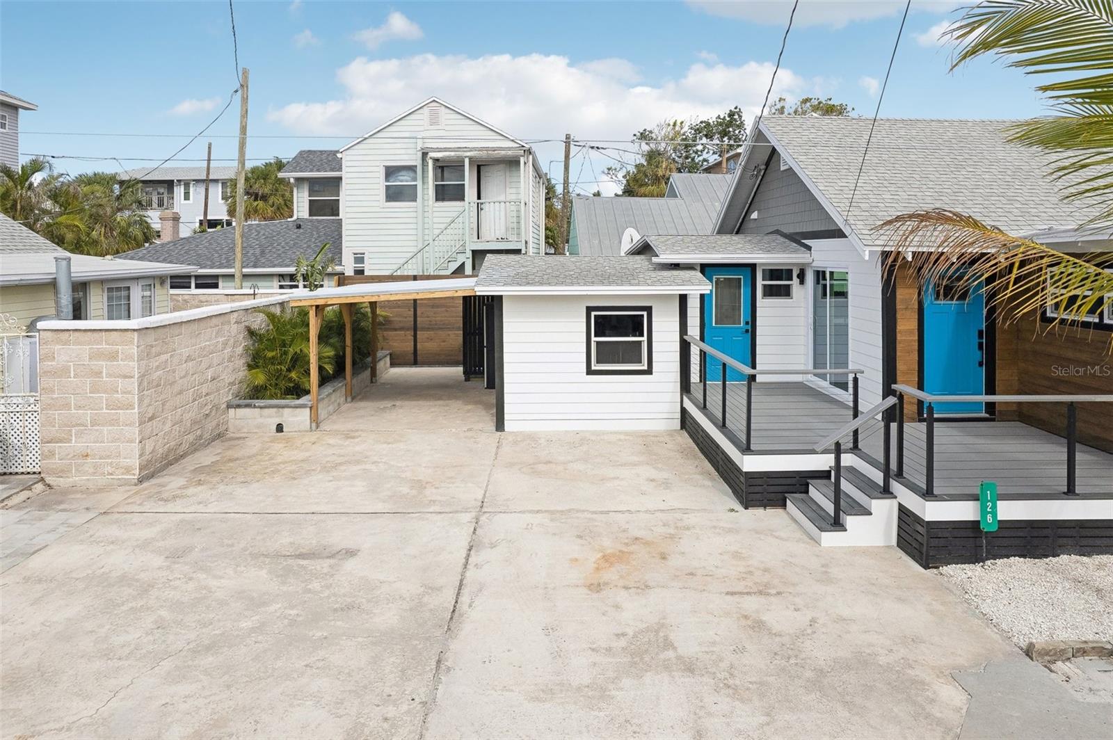 Carport and large parking pad on the west side of the house with room to park at least 4 vehicles.