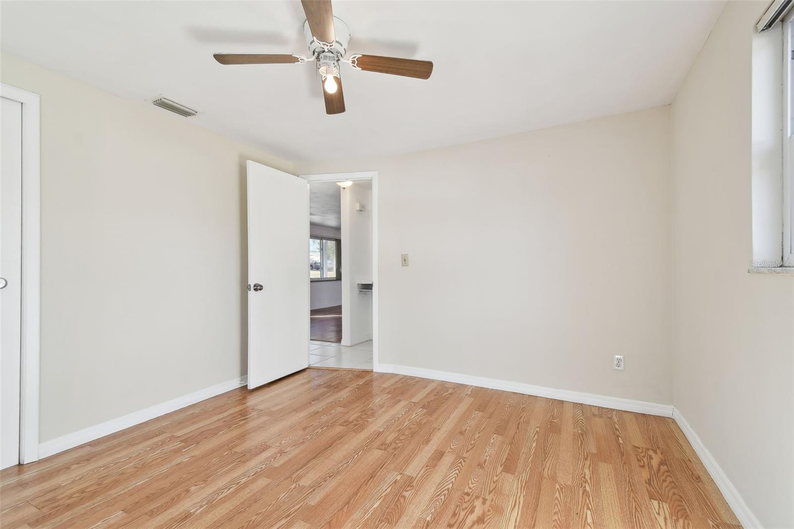 2nd bedroom - freshly painted, new flooring and ceiling fan