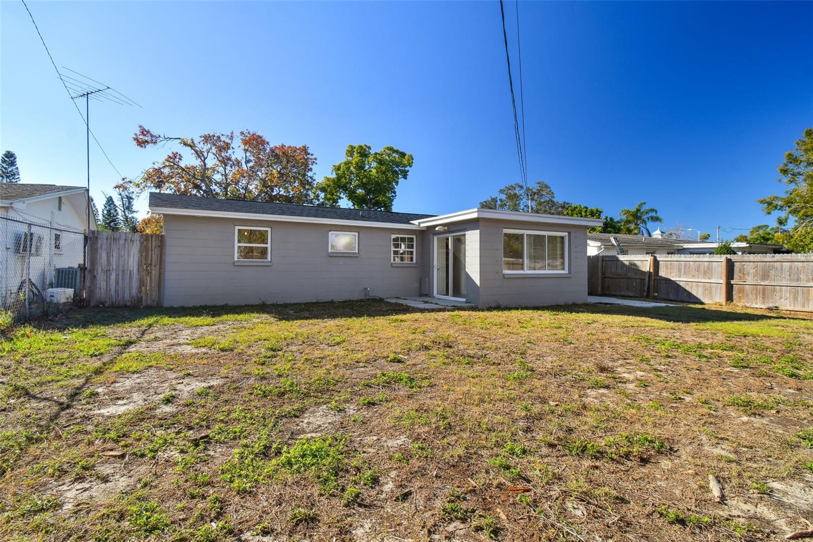 Large backyard for playset, garden or pets to roam. Room to expand the outdoor entertaining.