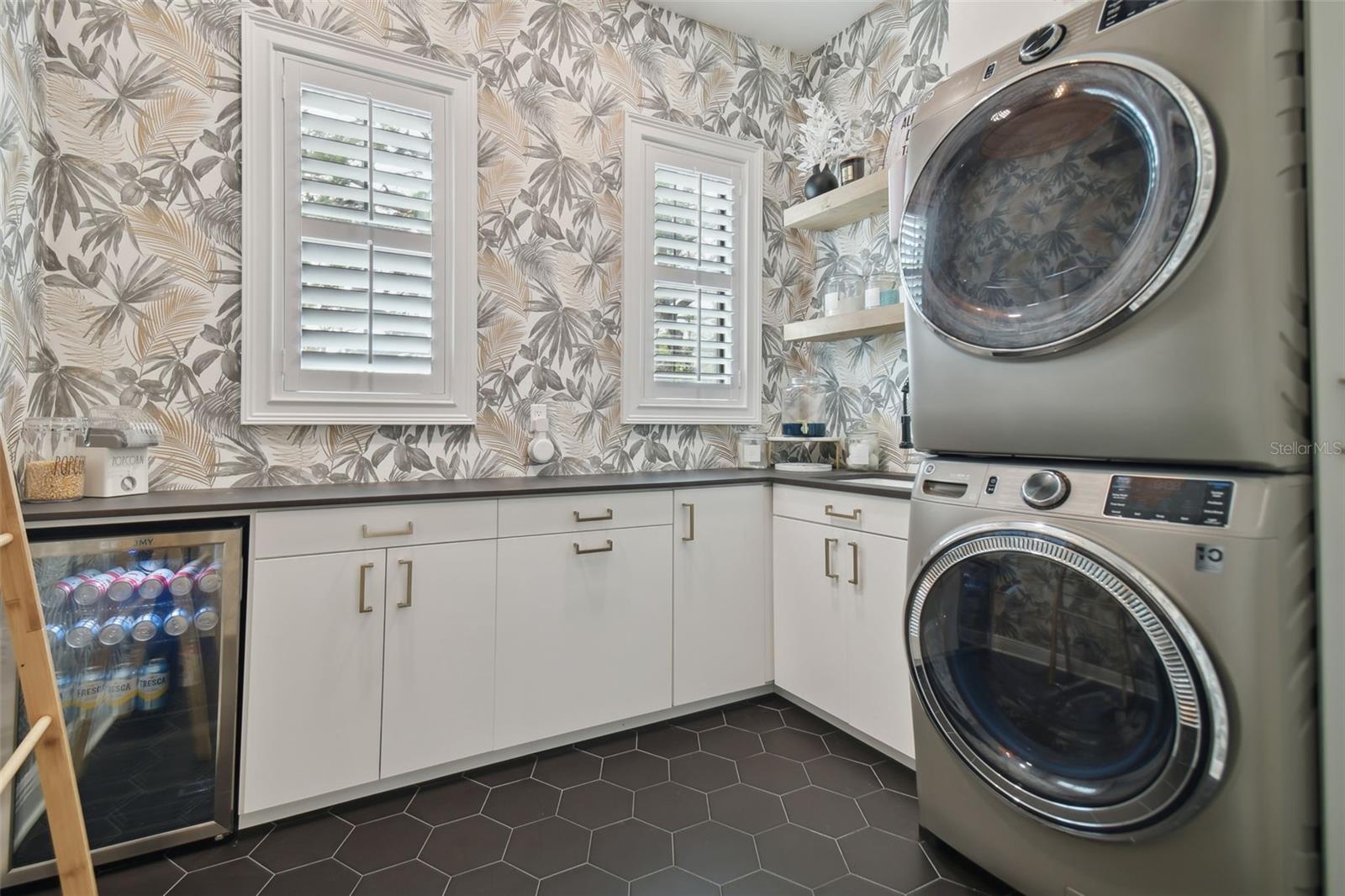 Laundry Room with Stackable Washer / Dryer, Cabinets, Sink and Beverage Refrigerator