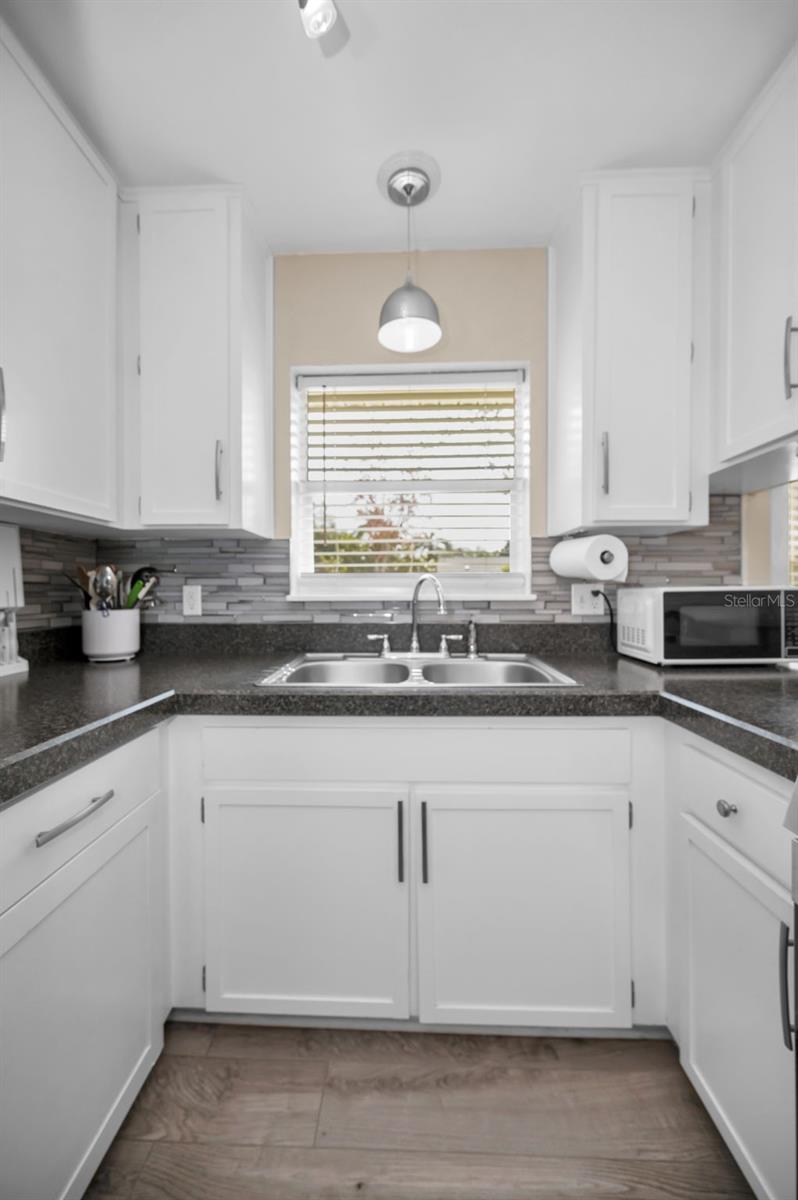 KITCHEN WINDOW TO ALLOW NATURAL LIGHT INTO THE SPACE