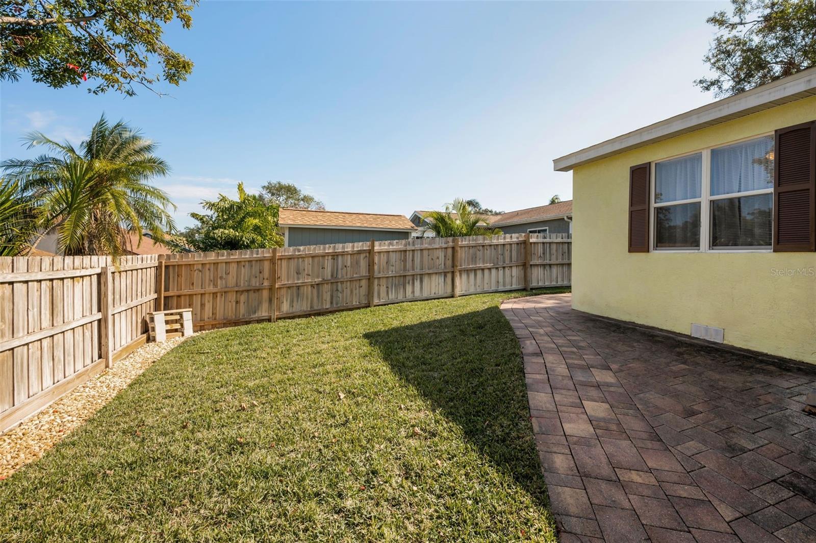 PLENTY OF SPACE IN THE BACK YARD!  YES!  THE GRASS IS GREENER!  THERE IS AN UPDATED IRRIGATION SYSTEM!