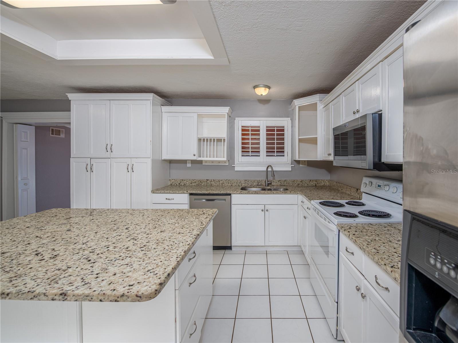 Granite countertops and tons of cabinets/storage