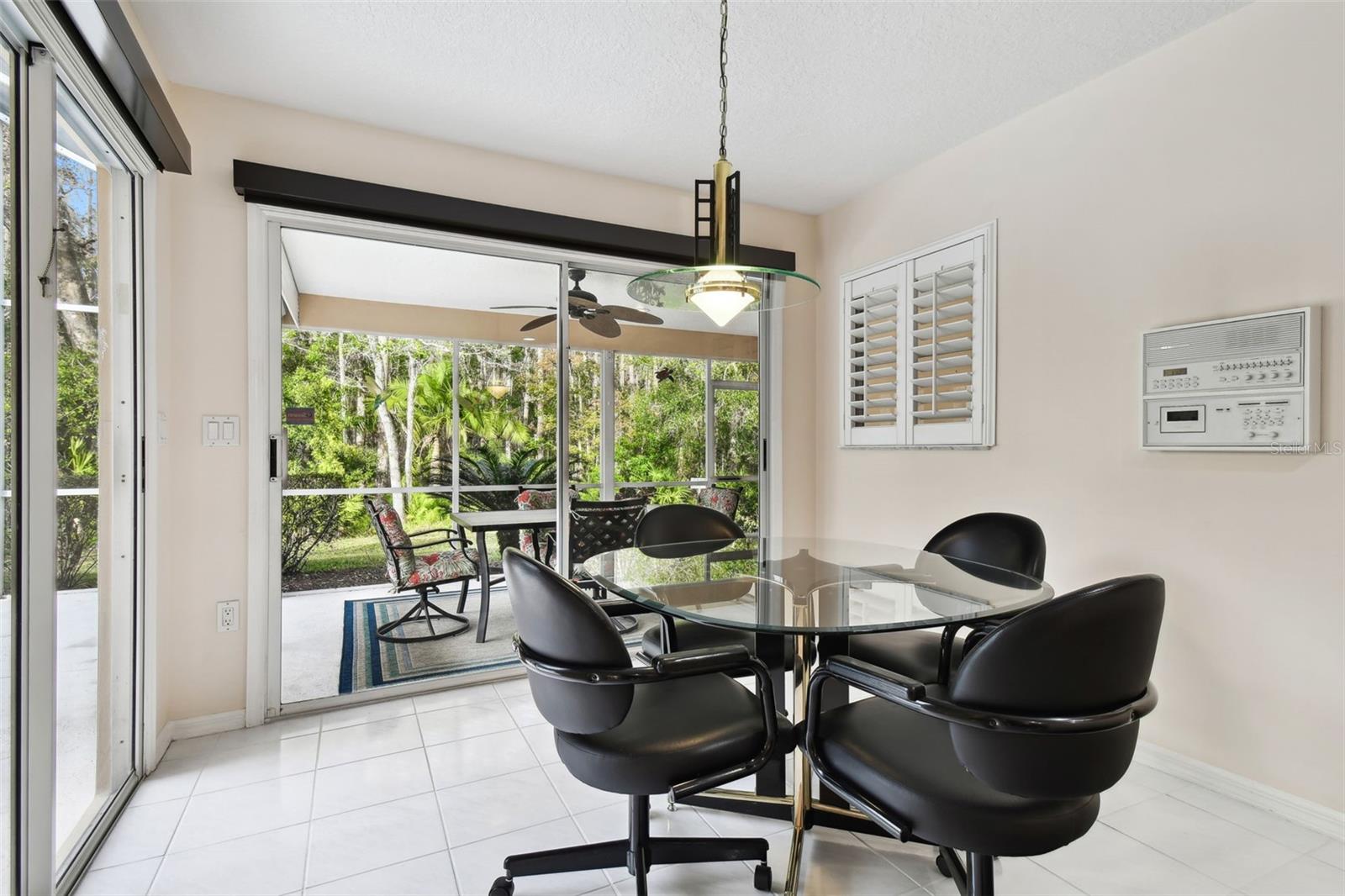 eat in kitchen with 2 sets of sliders out to the patio and pool area.