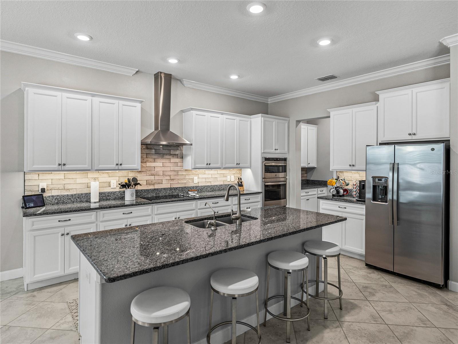 42 inch cabinetry, Granite Counter tops, Butlers Pantry, and walk in Pantry round off this amazing kitchen!