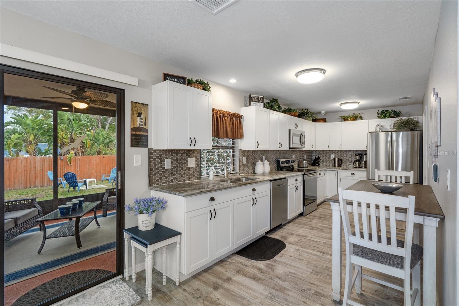 Kitchen with Sliders to Lanai and Eat-in Space