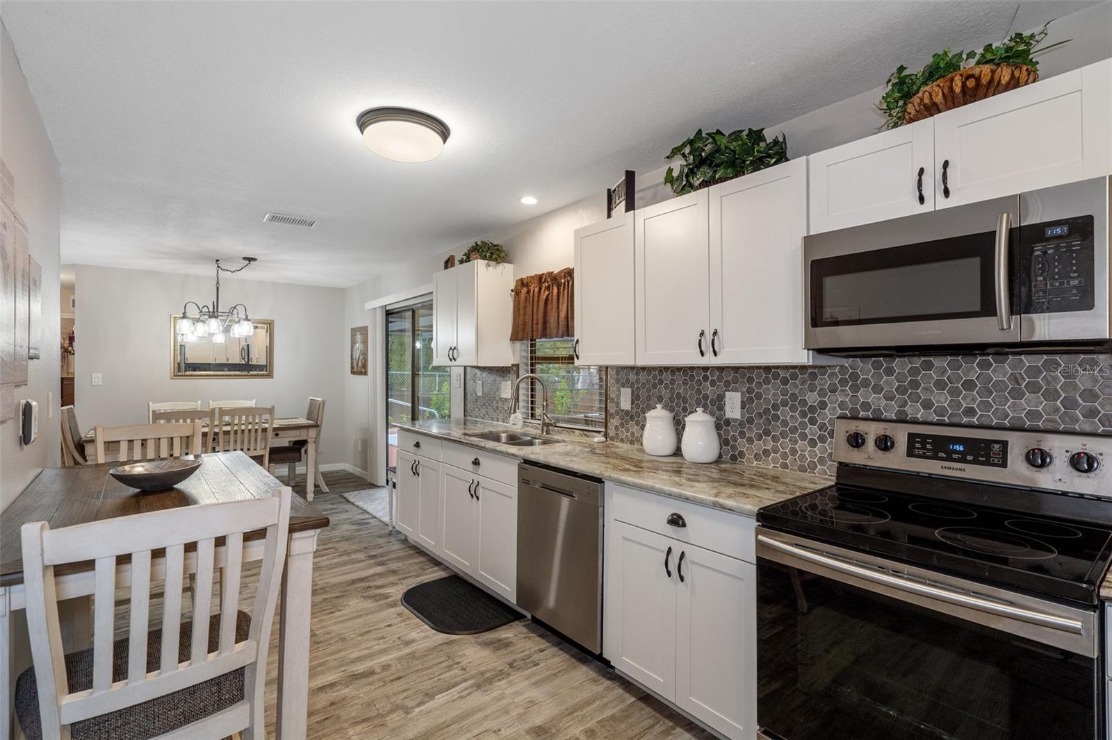 Beautifully Updated Kitchen with Granite, Cabinetry, & Stainless Steel Appliances