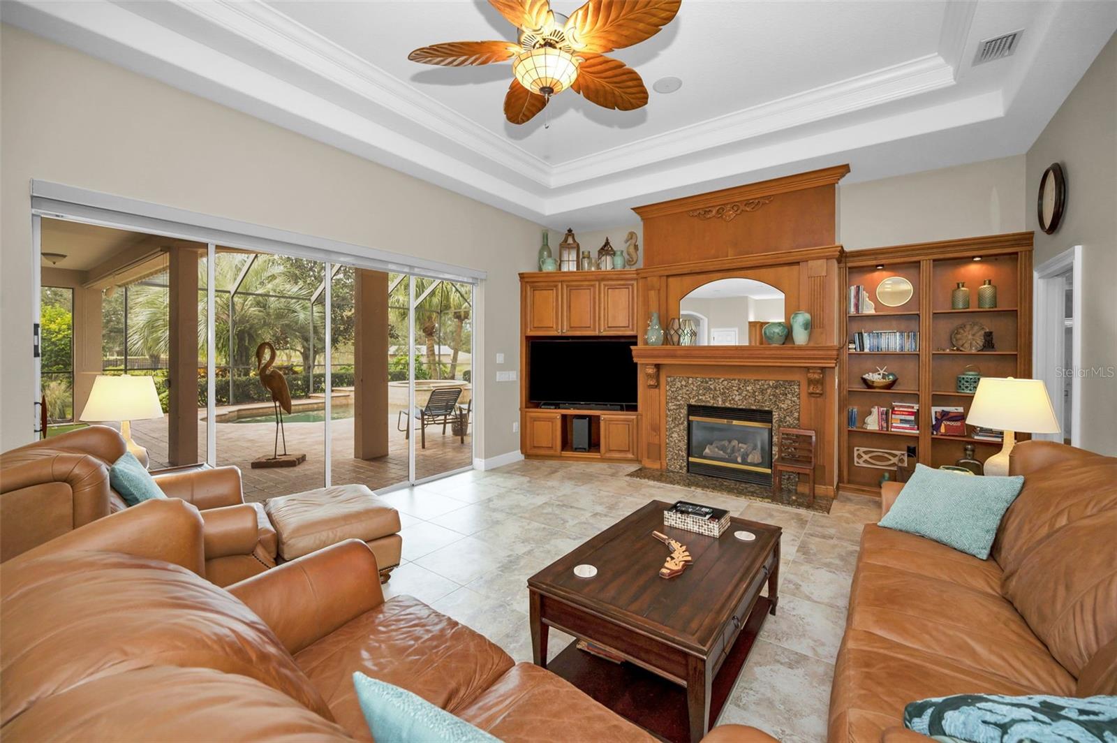 family room with tray ceiling