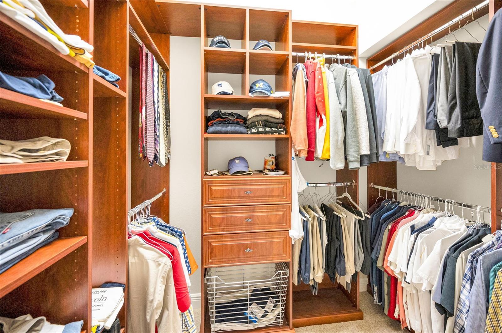 his and hers private closets with built in shelves