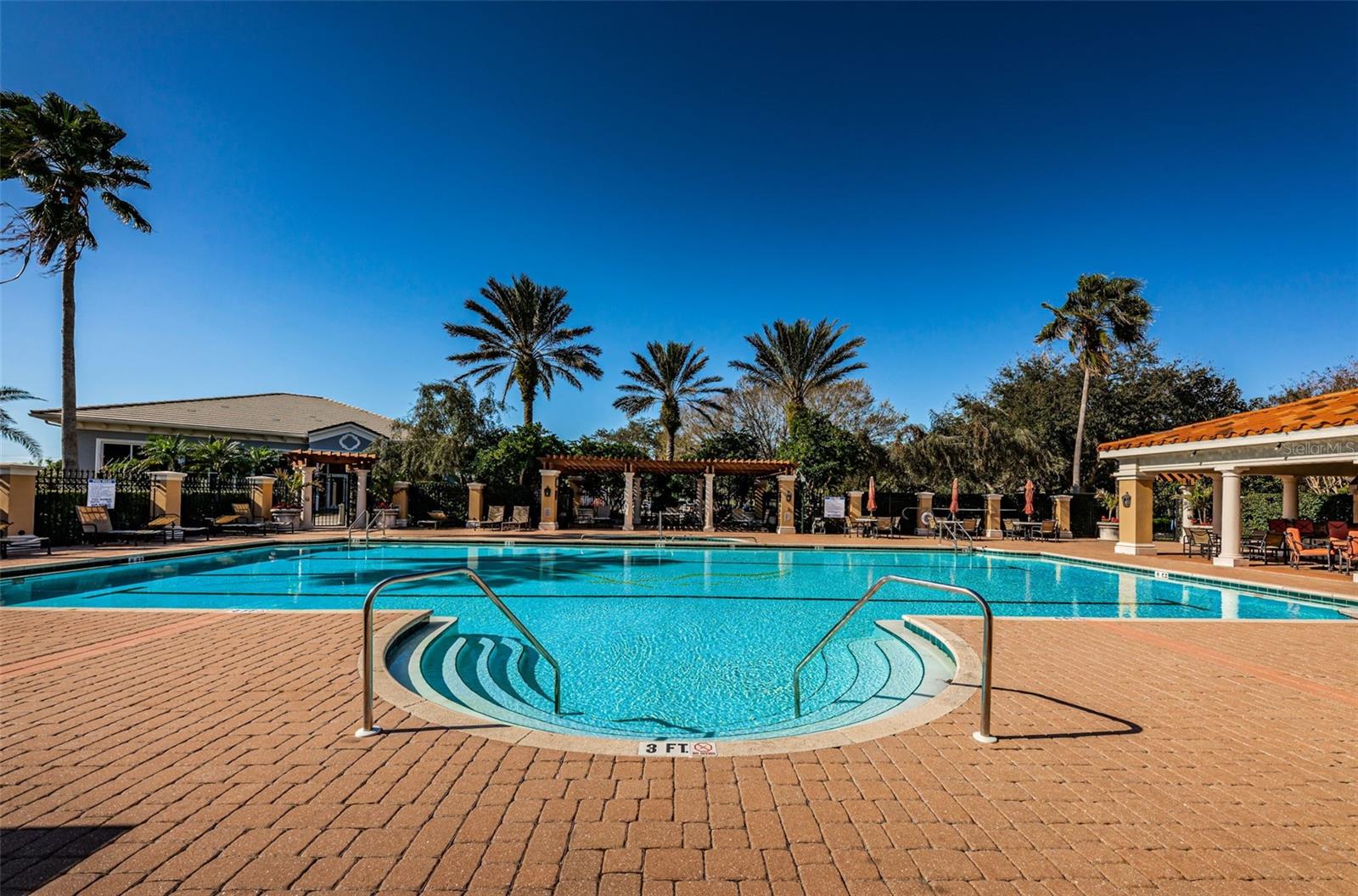 Enormous heated swimming pool and spa at Clubhouse