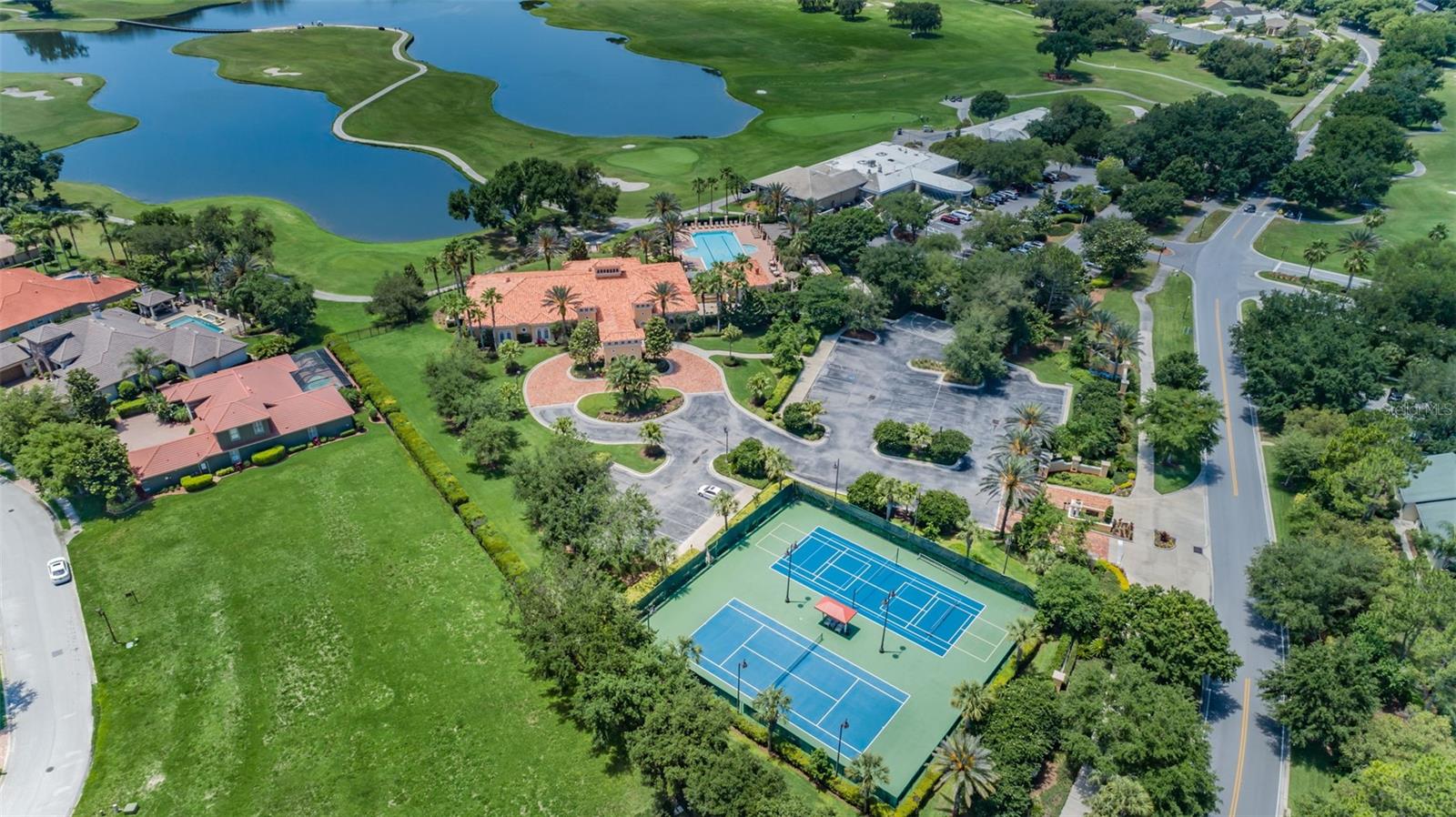 Ariel of Clubhouse showing pool and tennis courts