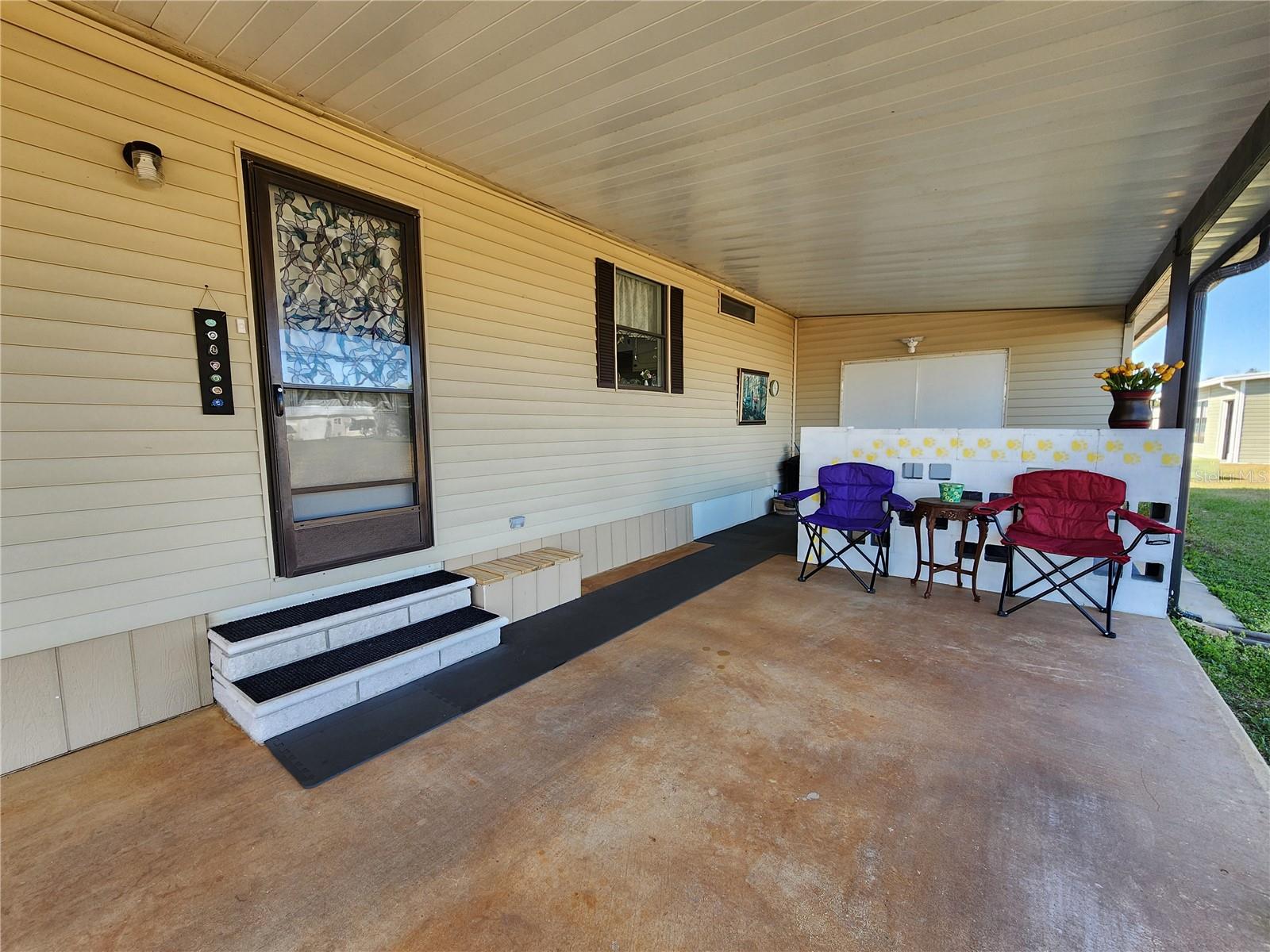 Carport & entry door to Kitchen.