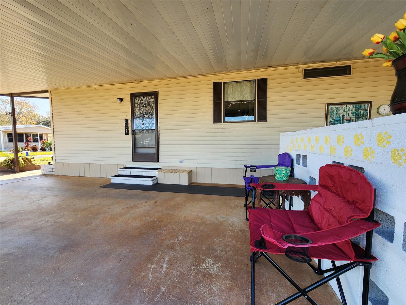 Decorative (removable) cement block privacy wall & entry door to Kitchen.