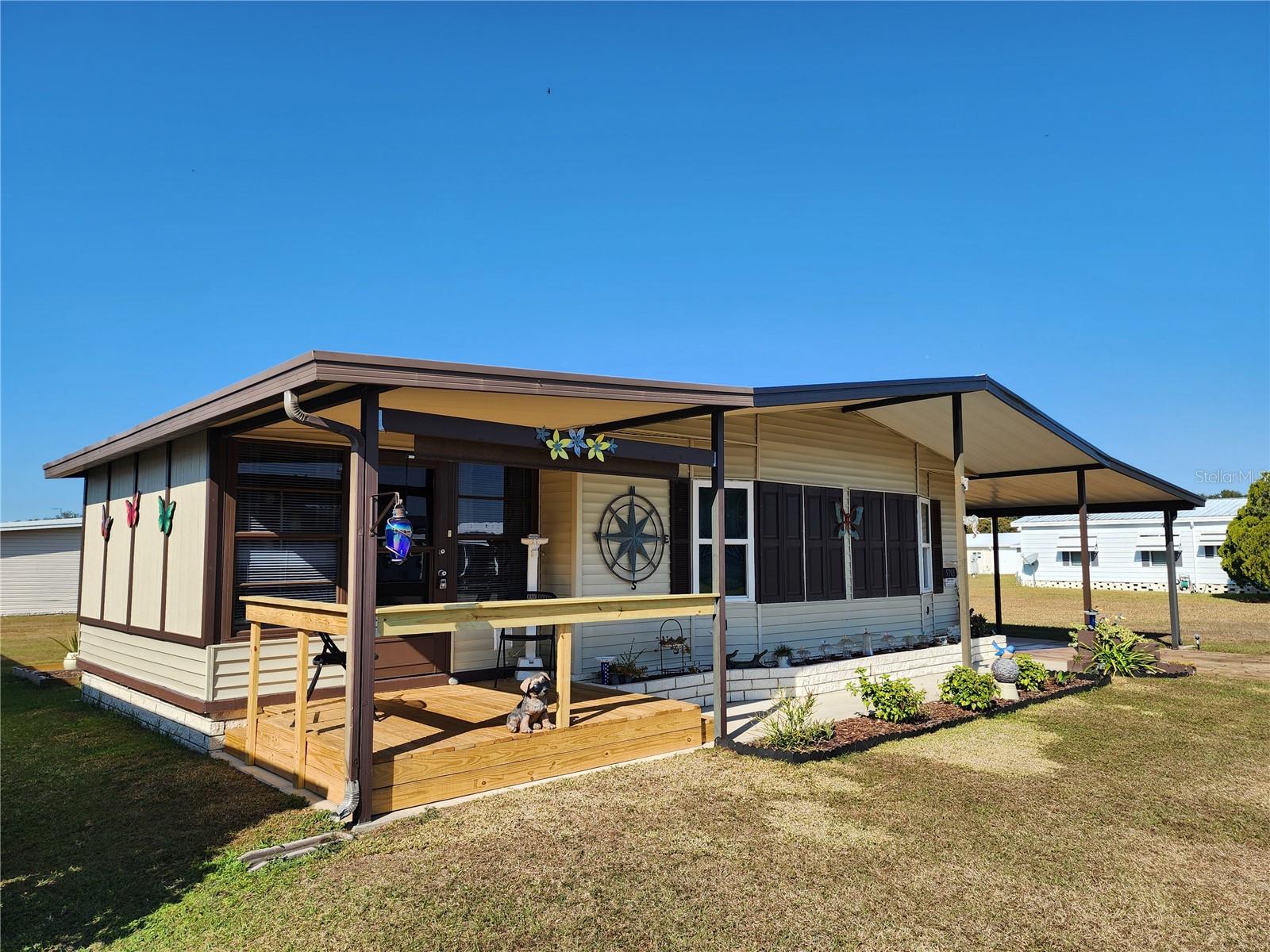 Front, raised covered deck & Florida room.