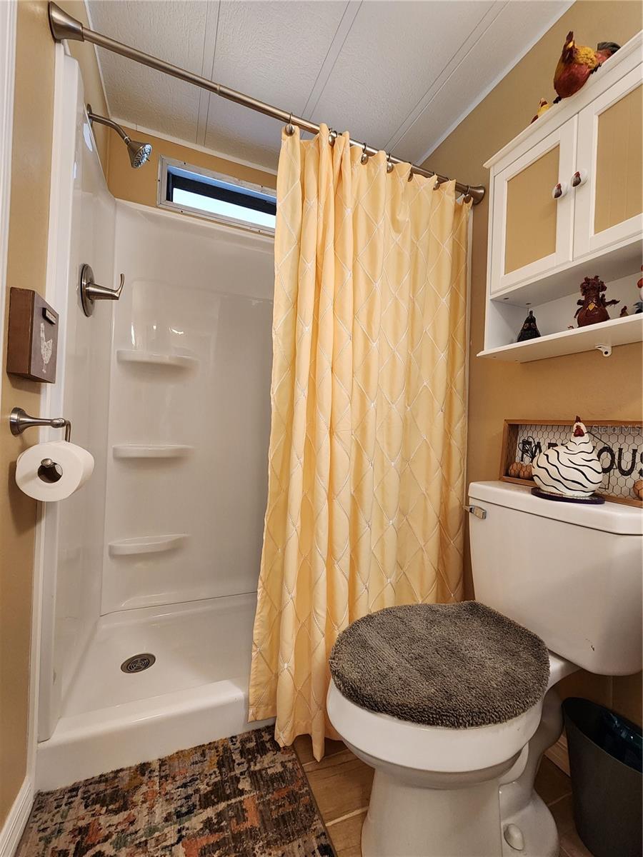 Updated hall bathroom with low step walk-in shower.