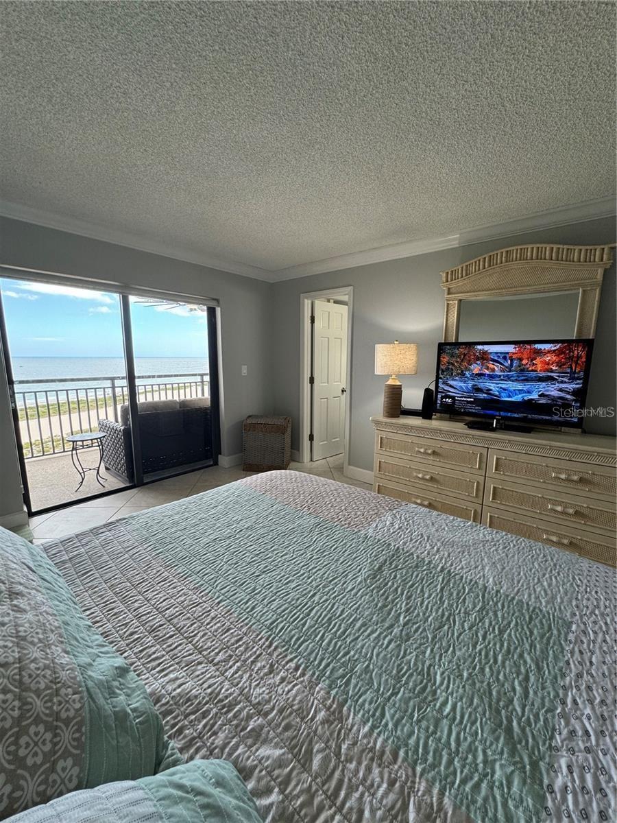 Incredible water views from the primary bedroom.