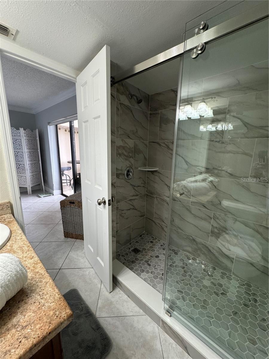 En Suite custom tile walk-in shower.