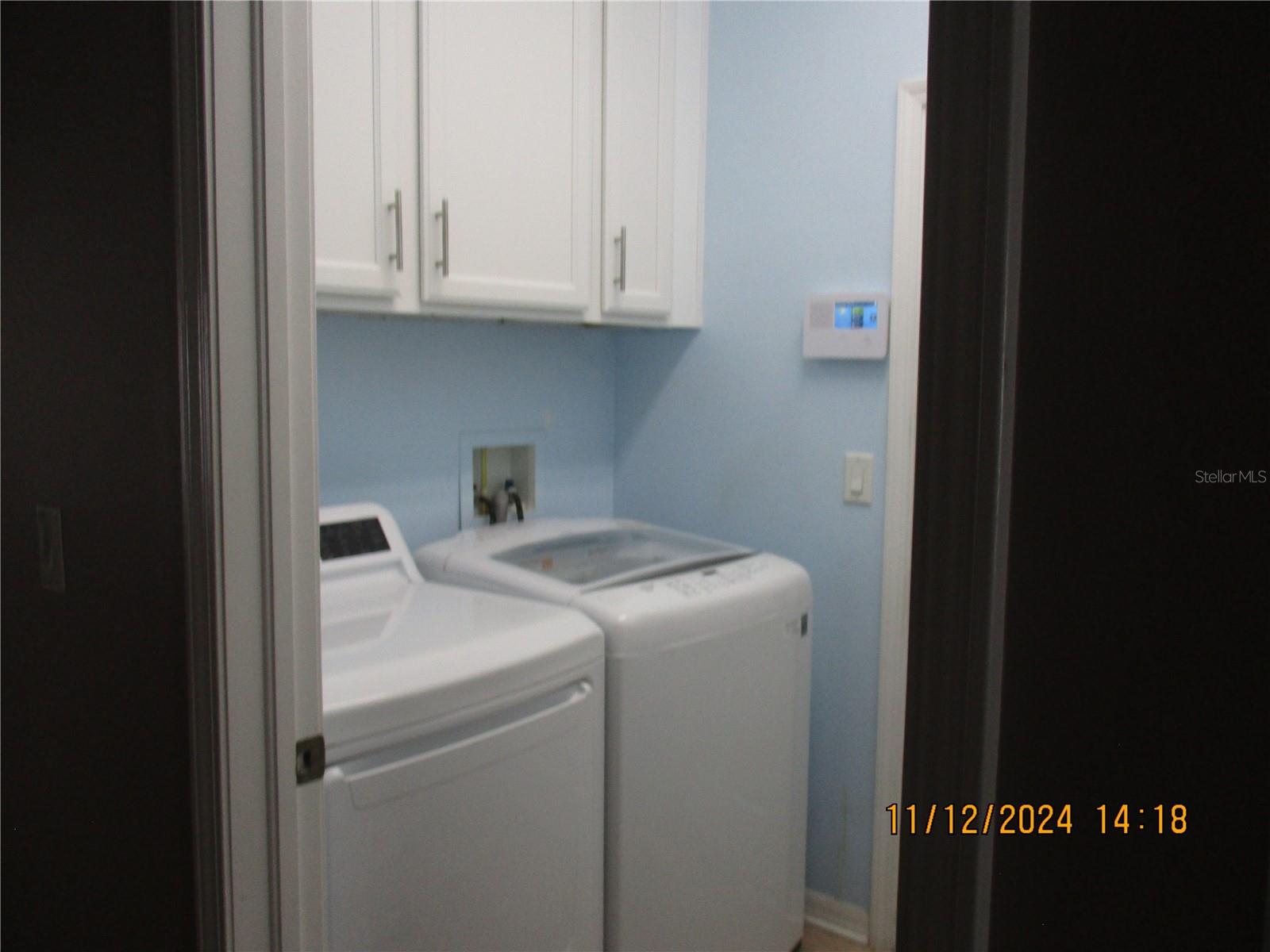 Laundry room with cabinets