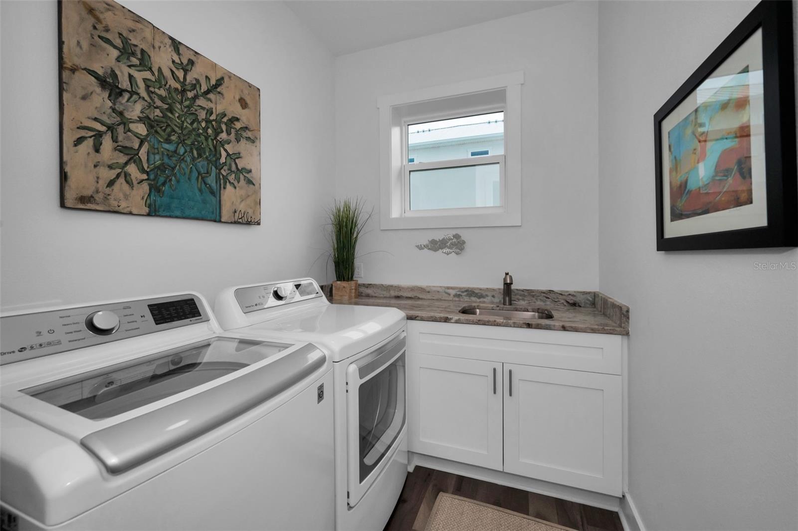 Main Level Laundry Room with Granite Counters