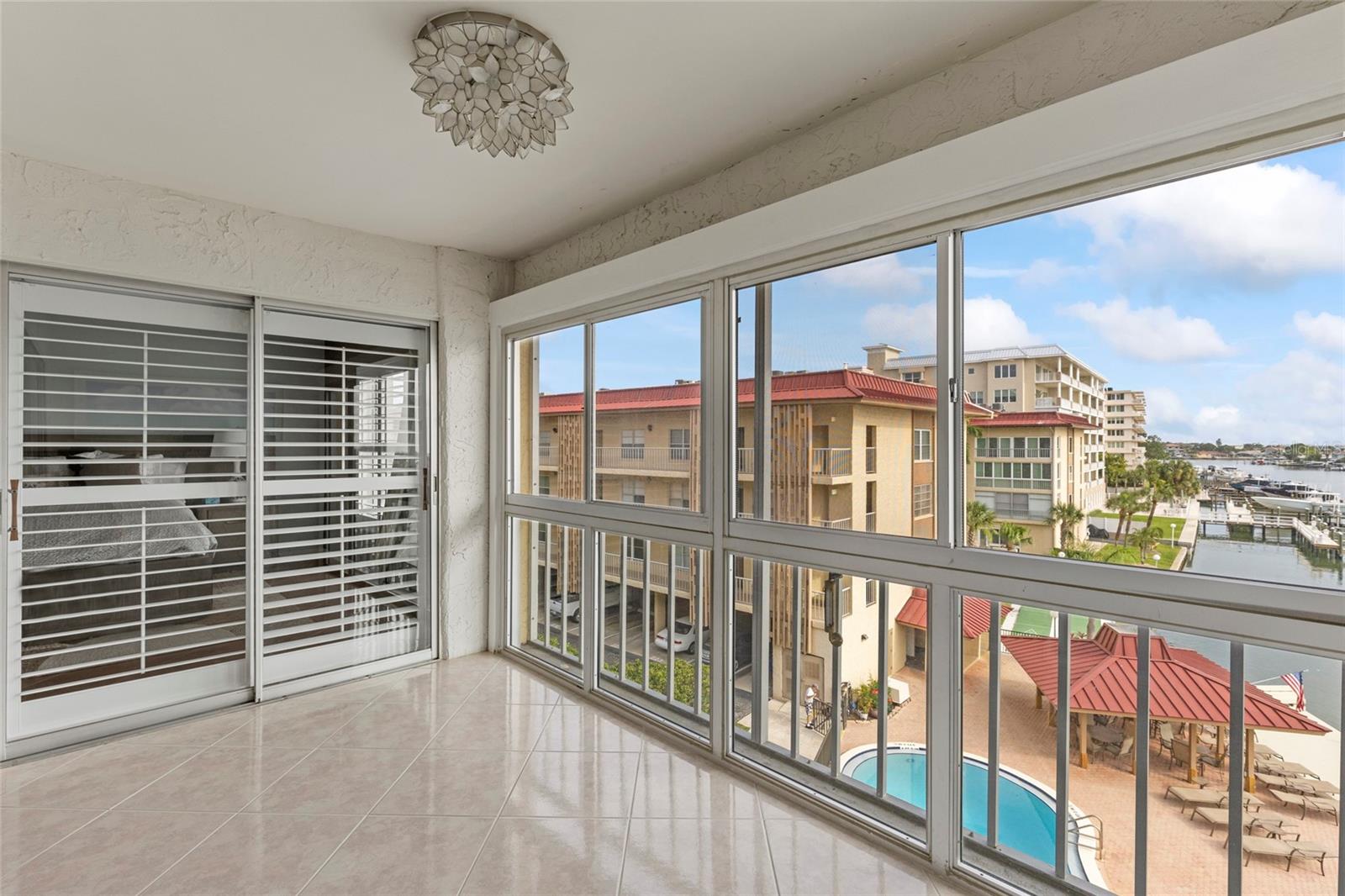 balcony with pool and water view