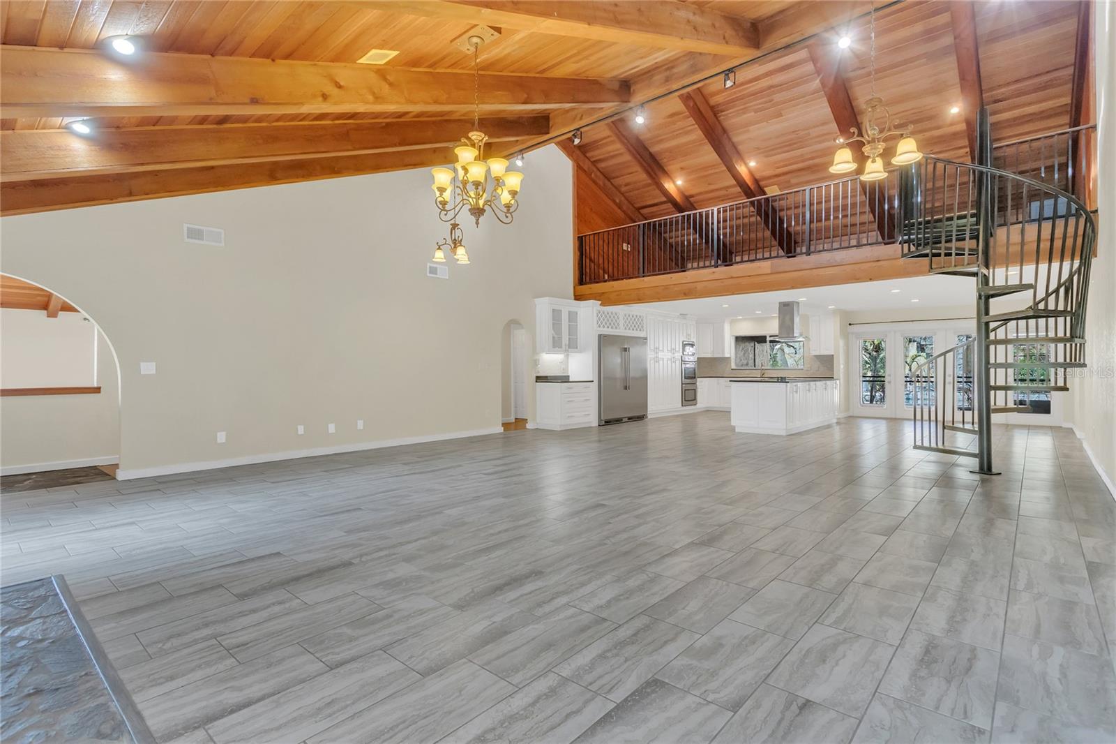 Living Room with a view of the loft and kitchen