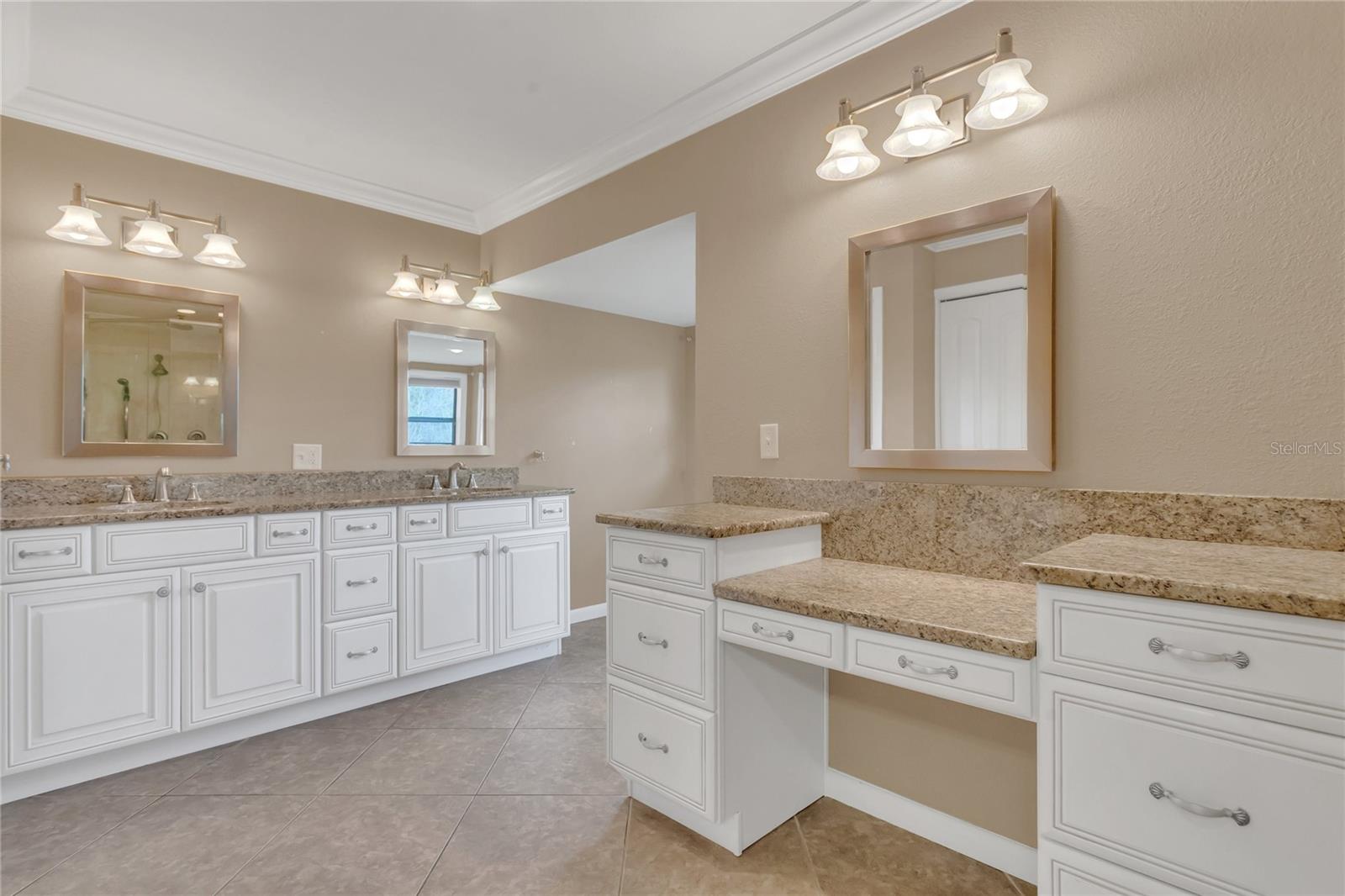 The primary bathroom with lots of counter space and storage