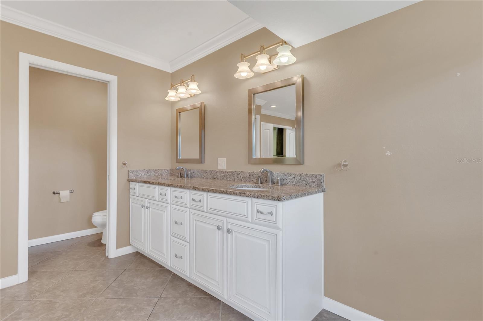 Primary bathroom with a private water closet