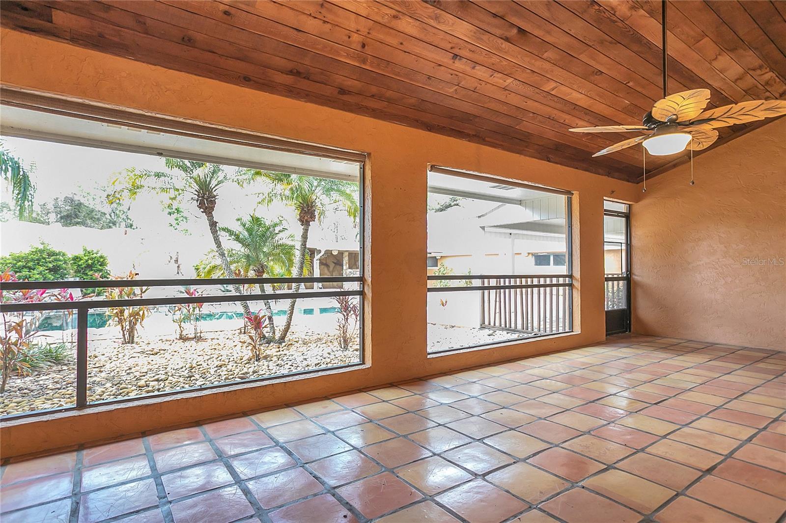 Screened back porch with saltillo tile