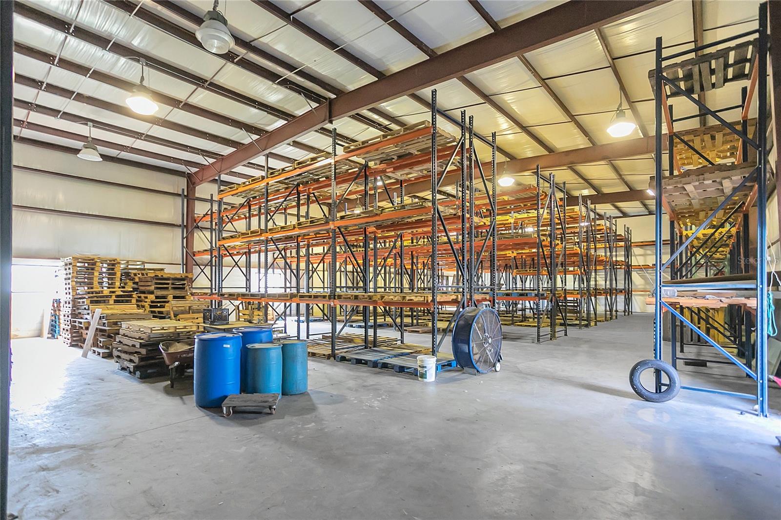 Shelving, pallets and barrels remain with the warehouse.