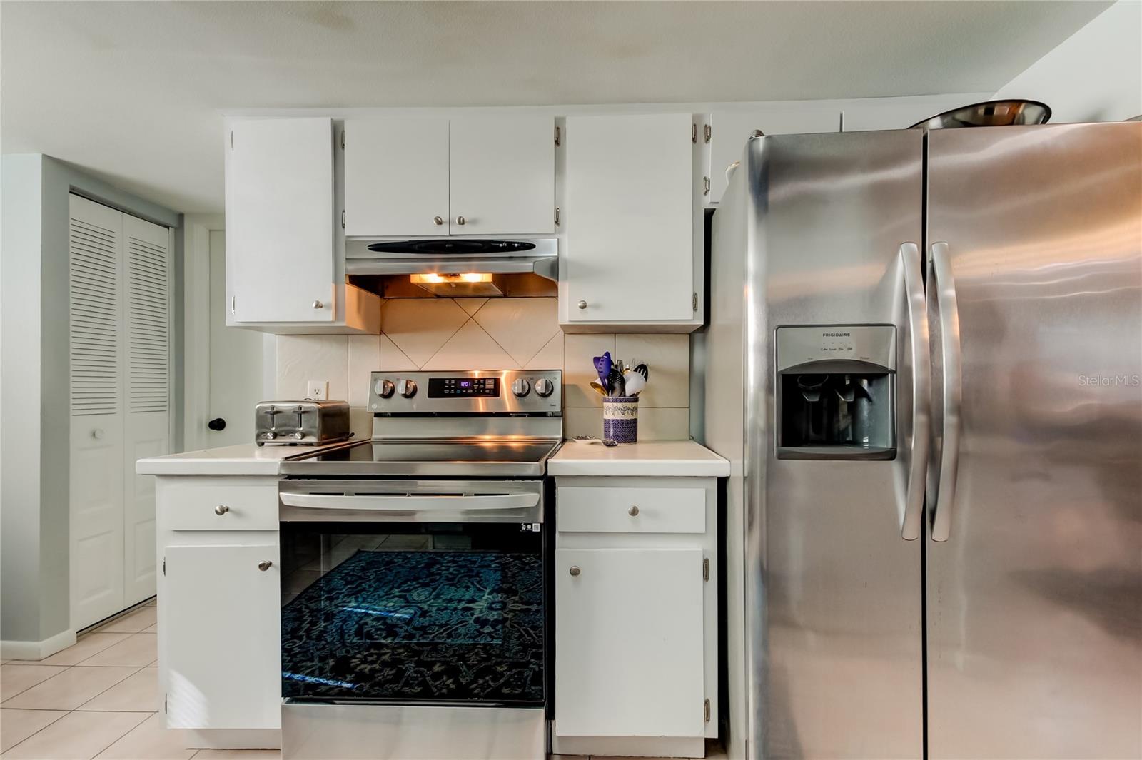 36. Kitchen (13' x 14.10') Features White Cabinetry w Brushed Nickel Pulls!